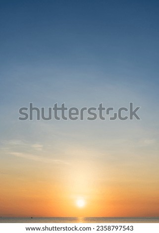 Sunset sky vertical over sea in the Morning with Orange Sunrise, Landscape bright sky horizon sea Royalty-Free Stock Photo #2358797543