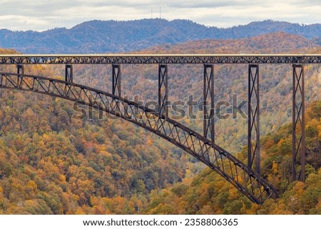 A beautiful shot of a colorful autumn landscape with a bridge in New River Gorge National Park