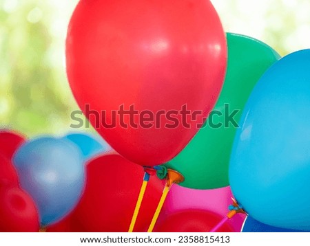 Colorful balloons with happy celebration party background. Bunch of colorful balloons on background. Close-up image of the bright colored balloons.