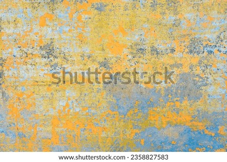 Painted mural bohemian background. Abstract art wall with peeled paint texture like an old fresco. Reminiscences of India. Pastel colors, oranges, greens and blues.