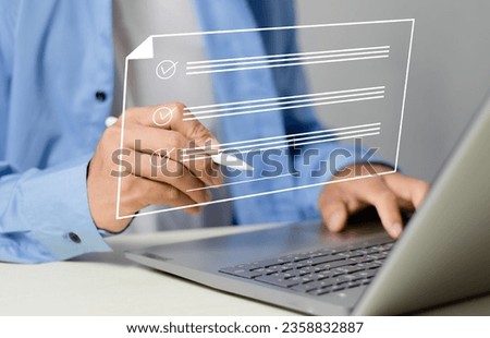 Electronic signing businessman signing electronic document on digital document on virtual laptop screen electronic signature, electronic signature concept.
