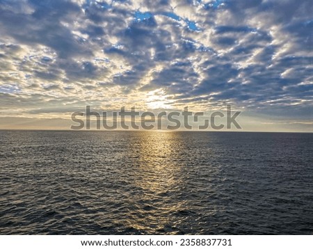 photo of sunrise at sea in the North