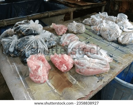 packages of various types of fish in the market
