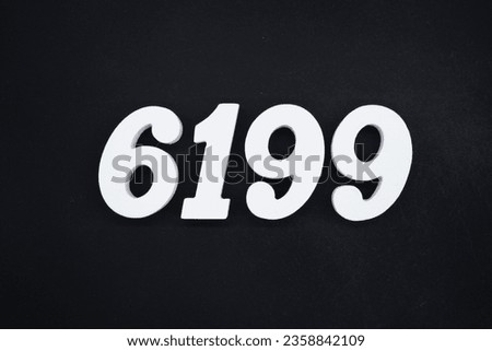 Black for the background. The number 6199 is made of white painted wood.