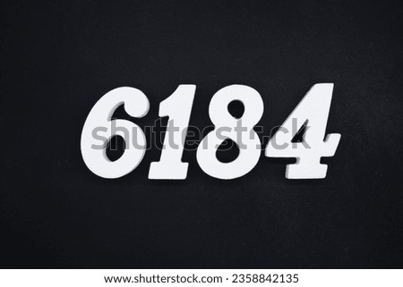 Black for the background. The number 6184 is made of white painted wood.