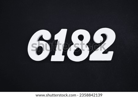 Black for the background. The number 6182 is made of white painted wood.