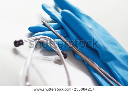 stethoscope with a rubber gloves