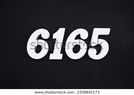 Black for the background. The number 6165 is made of white painted wood.