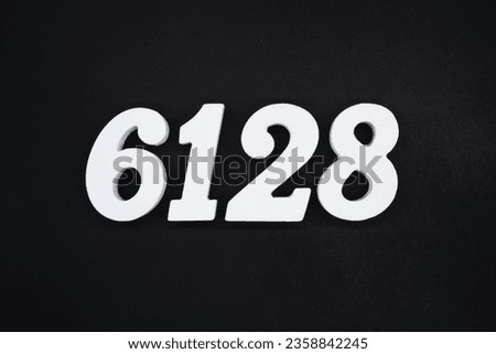 Black for the background. The number 6128 is made of white painted wood.