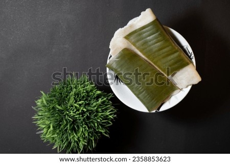 Ila Ada,Rice Dumplings covered in banana leaves Traditional Kerala Breakfast, Selective focus full Depth Of Field,South Indian breakfast known as Ela Ada filled with sugar and coconut and other spices