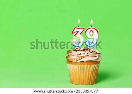 Birthday Card With Cupcake And Number 39 Candle; Photo On Green Background.