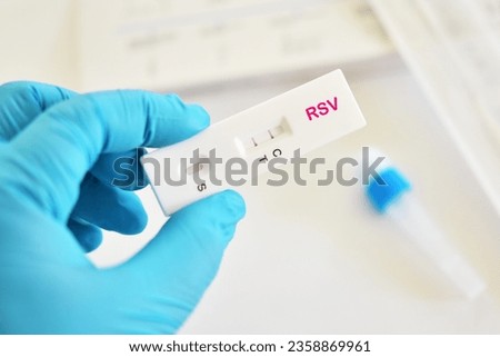 RSV positive test result by using respiratory syncytial virus (RSV) antigen test kit, rapid test method  Royalty-Free Stock Photo #2358869961