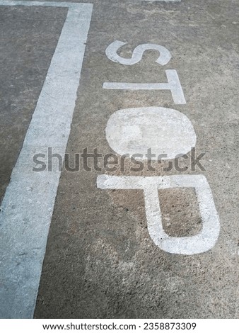 TRAFFIC SIGN ON CONCRETE ROAD 