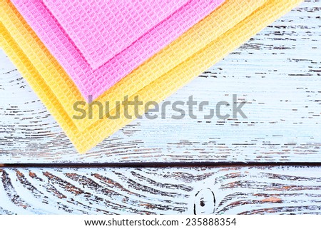 Colorful napkins on wooden table