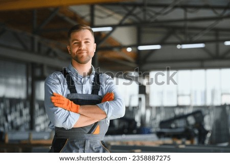 Profesional fabric worker. Metal processing plant. A worker at a metal profile warehouse