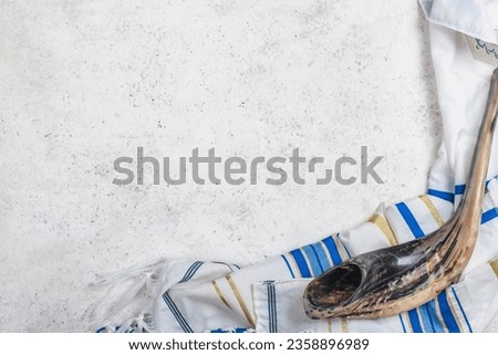 Shofar horn and tallit, copy space. Rosh Hashanah. Yom Kippur background Royalty-Free Stock Photo #2358896989