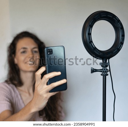 Capturing a Radiant Moment: Girl Recording with Her Mobile Phone