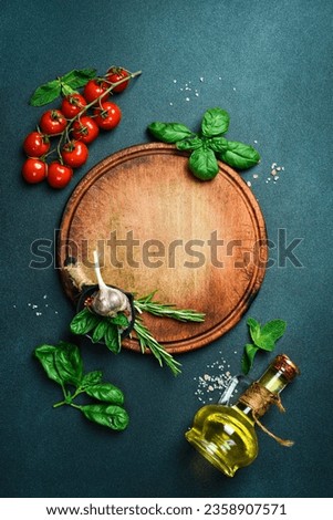 Kitchen banner. A set of vegetables and kitchen utensils on a black table. Free space for text. Top view. Royalty-Free Stock Photo #2358907571