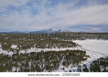A winter landscape of Lake Mary, Arizona, with the majestic Humphreys Peak in the background Royalty-Free Stock Photo #2358922085