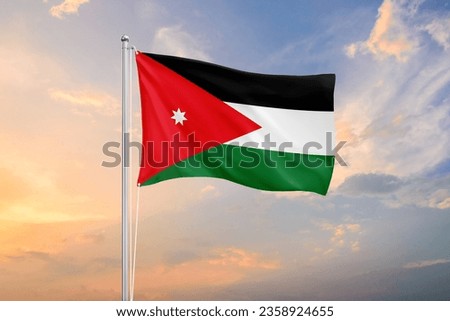 Jordan flag waving on sundown sky Royalty-Free Stock Photo #2358924655