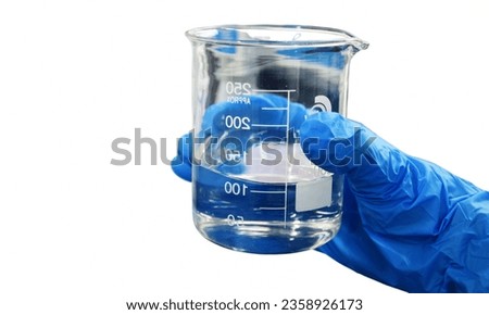 Beaker - A simple container for holding and mixing liquids. Royalty-Free Stock Photo #2358926173