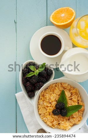 Delicious breakfast with  fresh berries on old wooden background 