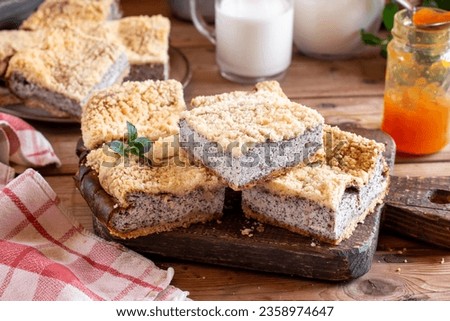 Sweet bakery - poppy pie with cottage on a wooden board. Poppy and cottage cheese cake in rustic style on a wooden table. Aesthetic composition with poppy seed pie. Cottage cheese dessert