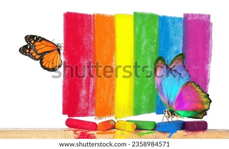 Colors of rainbow. Pastel crayons and abstract rainbow pattern. bright colorful tropical morpho butterfly and monarch butterfly on pastel crayons