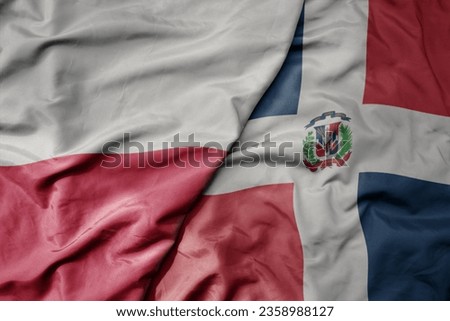big waving national colorful flag of poland and national flag of dominican republic . macro