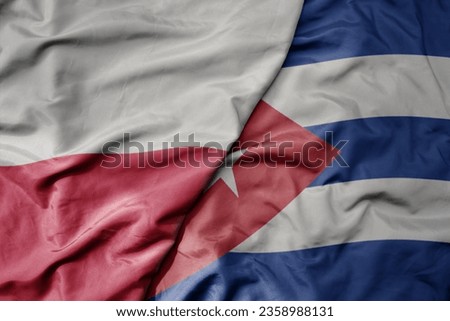 big waving national colorful flag of poland and national flag of cuba . macro