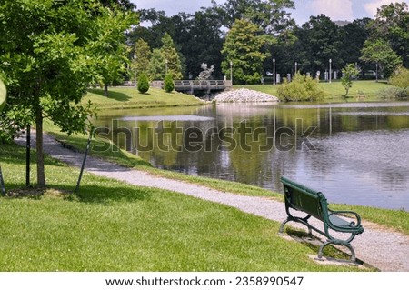 Scenic lakeside bench outdoor setting.