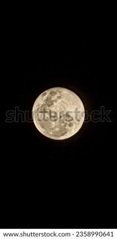 scenic picture of full moon in a clear dark sky