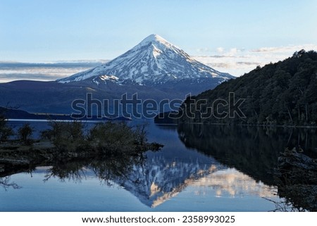 Stunning landscape over the Lanin volcano, reflecting in the Paimun Lake. Morning lights. Vertical photography. Lanin National Park, Patagonia, Argentina