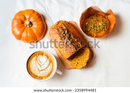 pumpkins and pumpkin cake bread, with hot coffee drink healthy autumn dessert food
