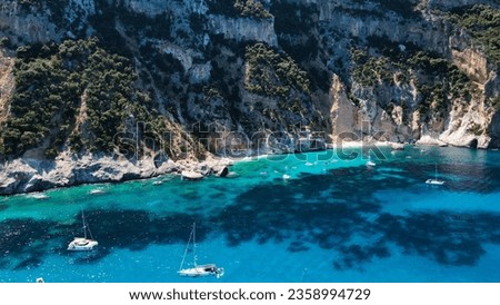 Aerial view of the famous Cala Goloritze in Orosei Gulf, East Sardinia, Italy. Drone and birds eye of clear and crystalline water over the top of Punta Salinas, Sardinia (Sardegna). Costa di Baunei.