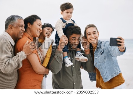 Happy family, grandparents and selfie on beach for kids holiday, vacation and outdoor on social media. Mother, father and senior people with interracial children in profile picture by the ocean
