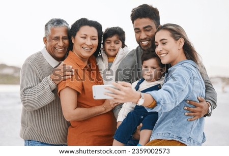 Family, grandparents and children in selfie on beach for holiday, vacation and outdoor on social media. Happy mother, father and senior people with interracial kids in profile picture or photography