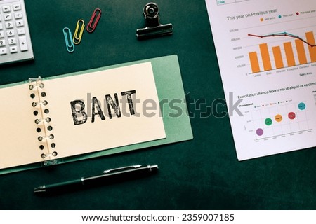 There is notebook with the word BANT. It is an abbreviation for Budget, Authority, Needs, Timeframe as eye-catching image.