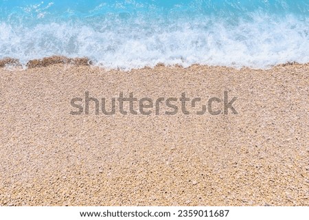 Seashore of small white pebbles on the beach in Oludeniz, blue lagoon. The cleanest beach with a blue flag. Background