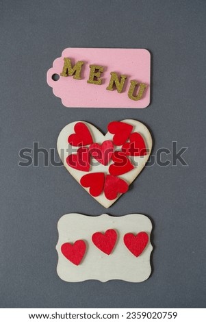 decorative sign with menu and hearts on paper