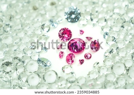 
Pink gemstones is displayed on a white background swirling around.
Pink diamonds of various sizes and shapes are displayed in the middle of white diamonds.
Sweet pink diamonds.white gems background
