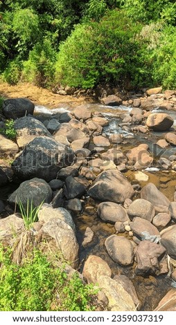 river and rocks with clear water 