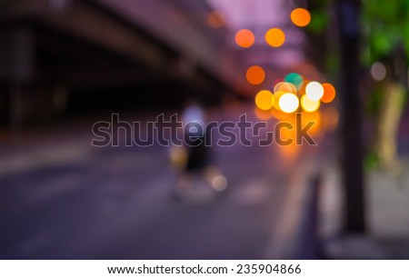 Abstract Bokeh color light of Student walking Zebra Crossing on road