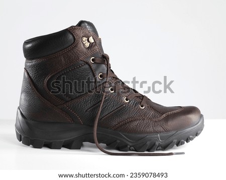 Leather winter boots isolated on white background