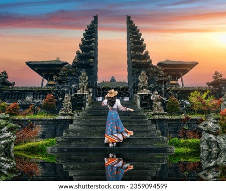 Women tourists standing at Besakih temple in Bali, Indonesia. Royalty-Free Stock Photo #2359094599