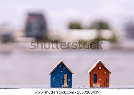 Small residential toy house on blur background. Create a house concept.