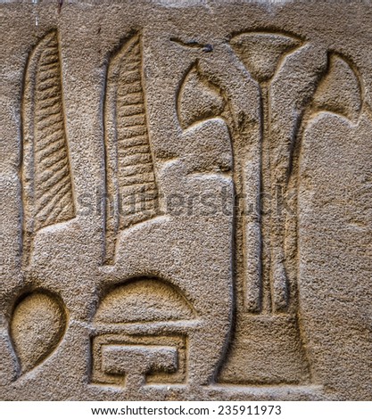 Egyptian hieroglyphs on the wall in a temple