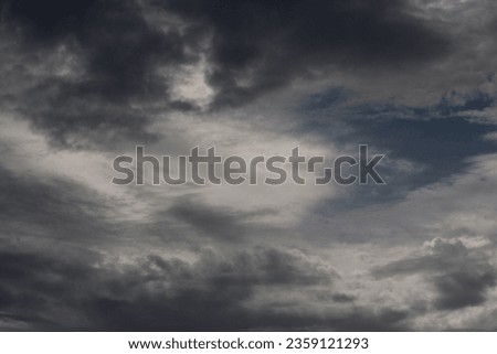 sky with white and grey clouds on a moody day