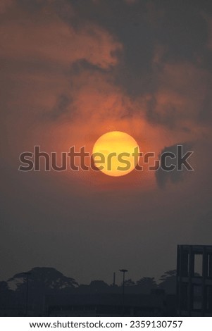 Burning orange sun during sunrise in Changi, Singapore. 
