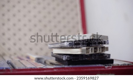 stack of 90s pitas tapes isolated style blur background